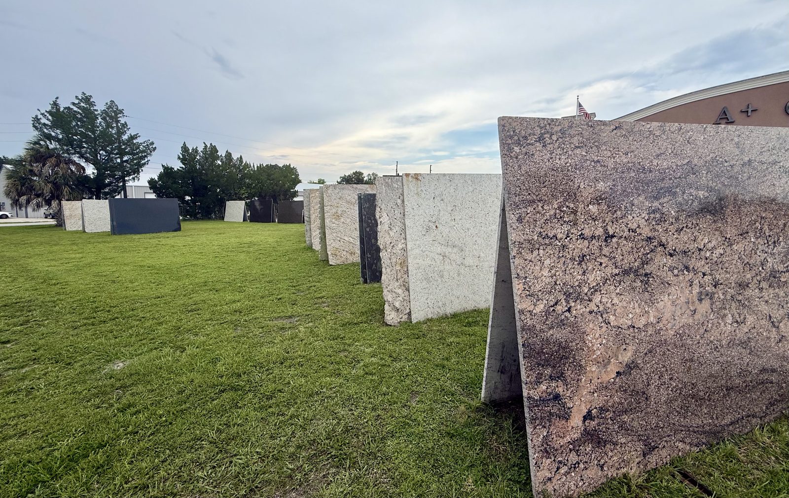 Granite and quartz slabs displayed on the Old Daytona Road frontage
